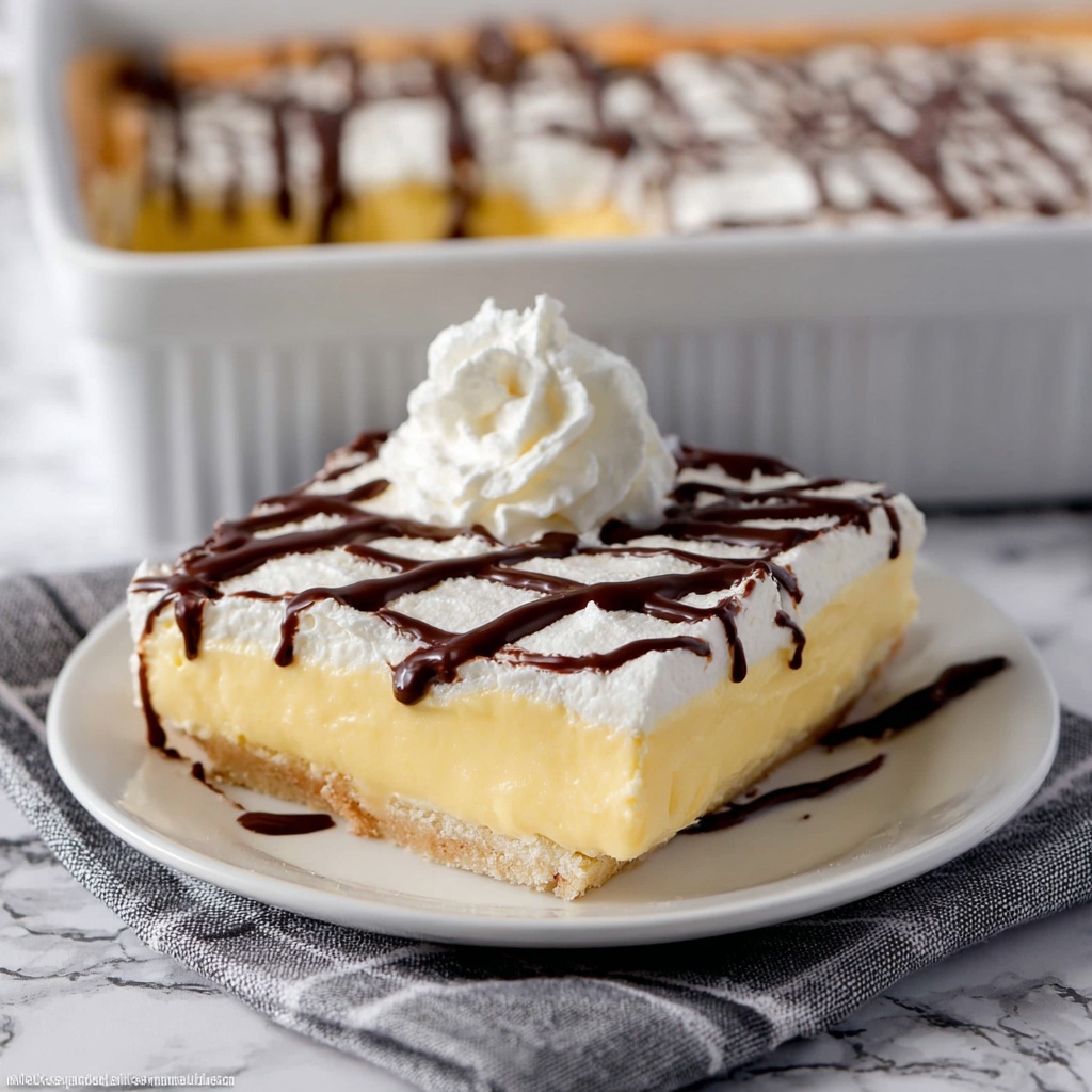 Cream Puff Cake with Vanilla Pudding and Chocolate Topping Recipe - Recipe Image